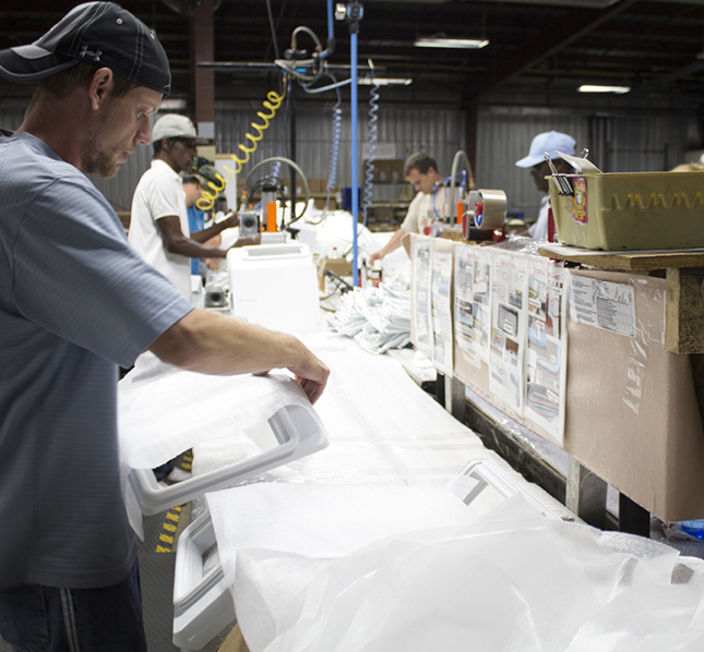 Crew at work with Goodwill's Light Manufacturing Program