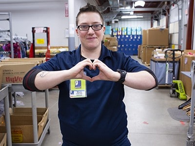 I ♥ Goodwill! Person makes the heart gesture with their hands