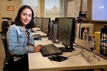 Young woman at computer workstation