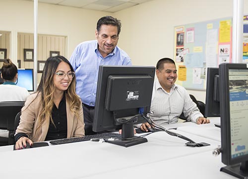 Woman and man receive computer training