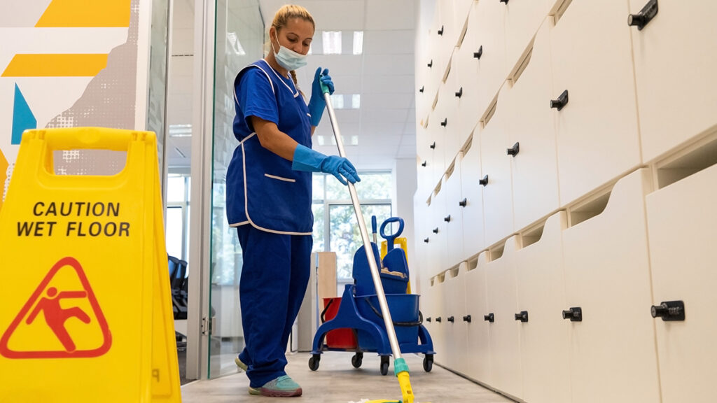Female custodian cleaning hospital floors