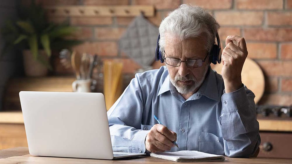 Mature gentleman at laptop