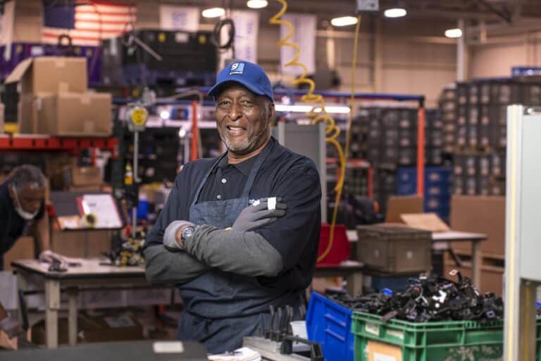 Senior African-American man on the production line.