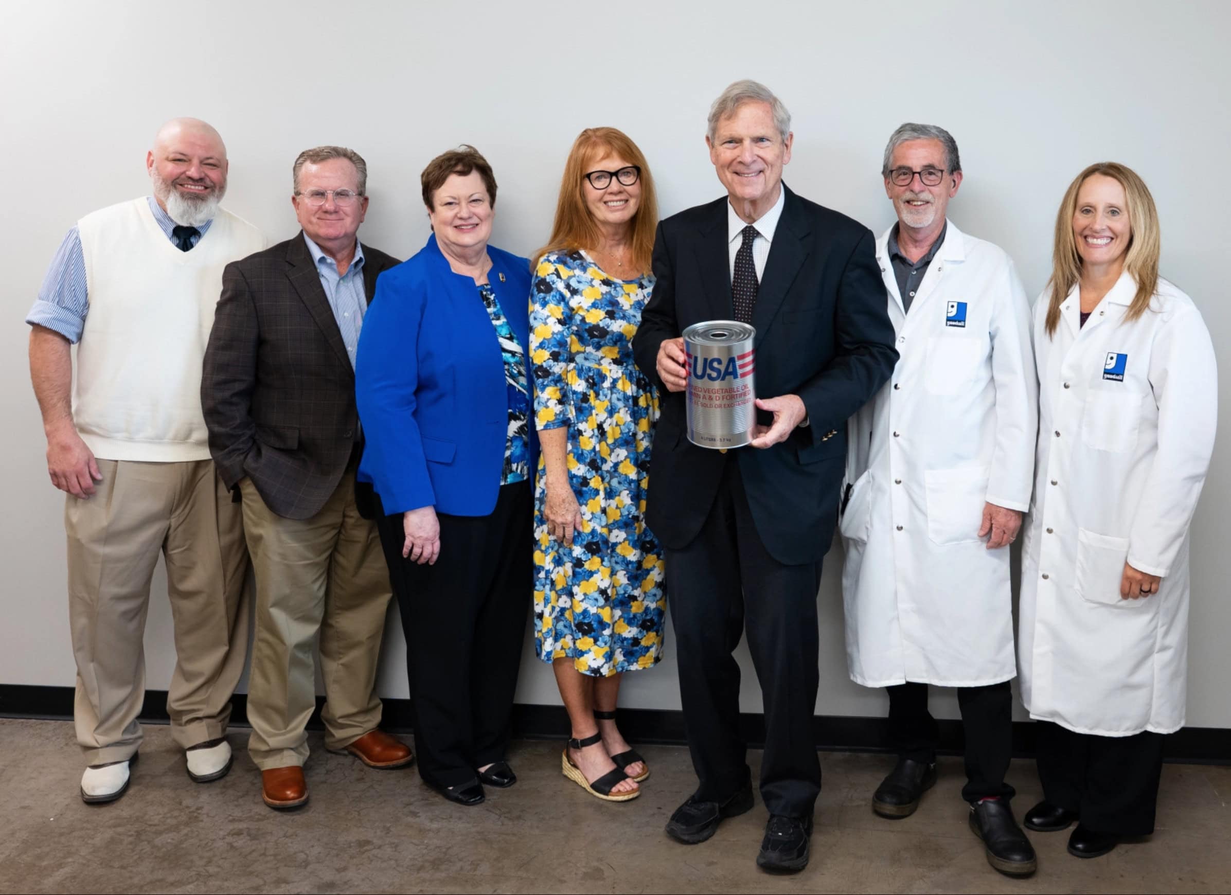 Former Iowa Gov. and U.S. Secretary of Agriculture Tom Vilsack toured Goodwill's Oil Packaging Plant in Coralville during June 2026. In this photo, Vilsack stands with World Food Prize and Goodwill of the Heartland team members. 
